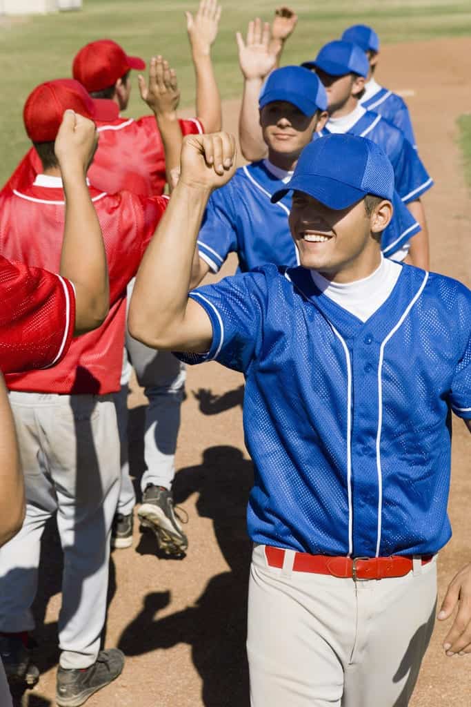 Teams High-Fiving Each Other --- Image by © Royalty-Free/Corbis