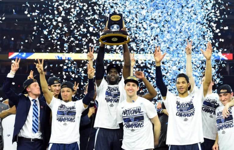 Villanova Wildcats forward Daniel Ochefu hoists the national championship trophy with teammates after defeating the North Carolina Tar Heels in the championship game of the 2016 NCAA Men's Final Four at NRG Stadium, April 4, 2016.