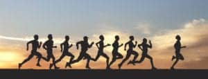 Marathon, black silhouettes of runners on the sunset