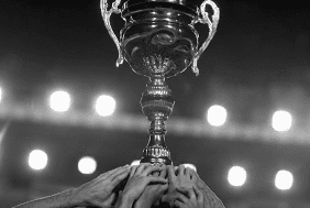 trophy-held-up-b&w