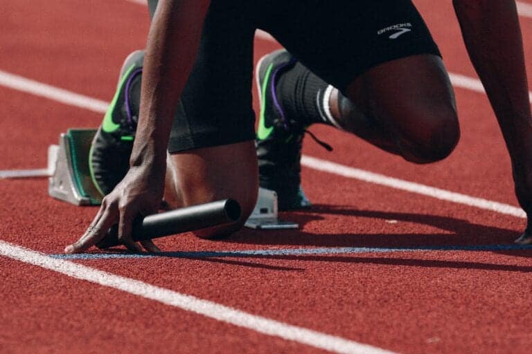 athletics track, athlete in start blocks